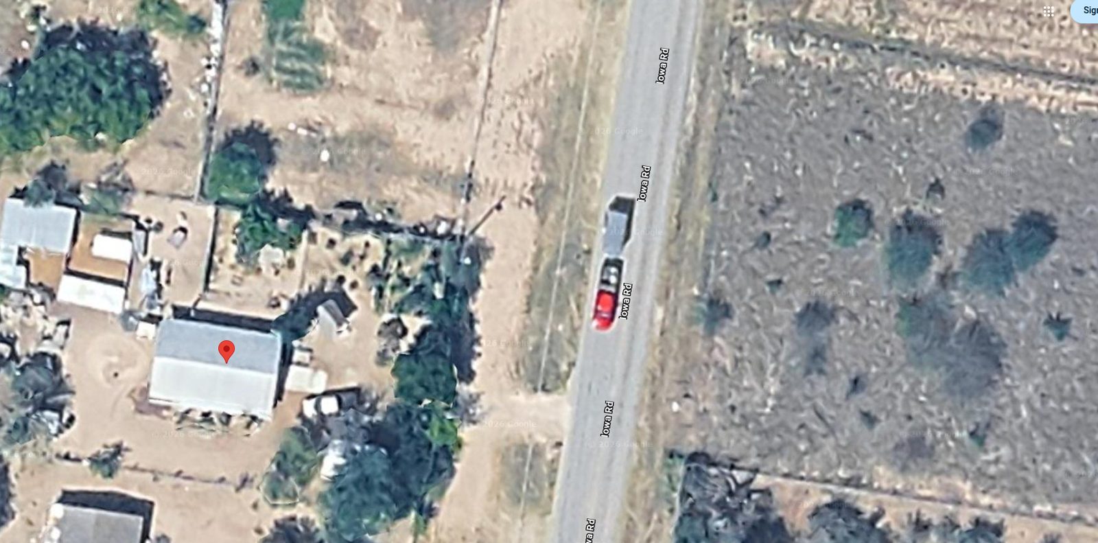 Aerial view of the house and half-acre lot